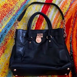 Michael Kors black leather and rose gold accents hardware